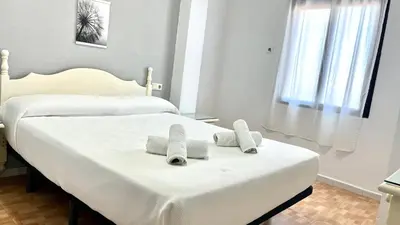 Cama o camas de una habitación en Hostal Carlos III