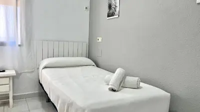 Cama o camas de una habitación en Hostal Carlos III