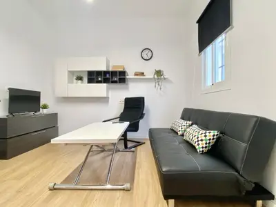 Una televisión o centro de entretenimiento en Apartamento Villa María III