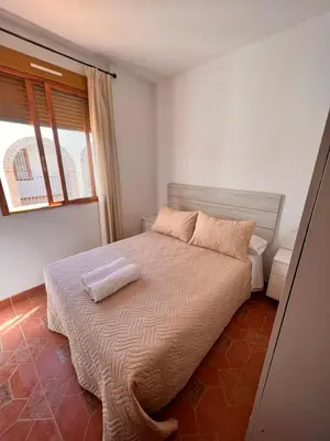 Cama o camas de una habitación en APARTAMENTO LA MURALLA 2