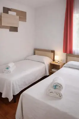 Cama o camas de una habitación en Lyrioshomes Apartamento Filpo Rojas , Sevilla