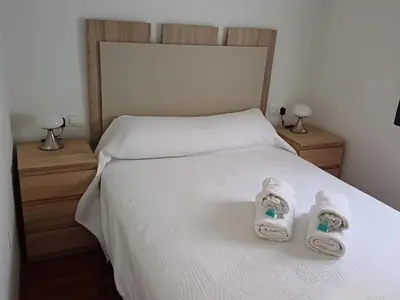 Cama o camas de una habitación en Lyrioshomes Apartamento Filpo Rojas , Sevilla
