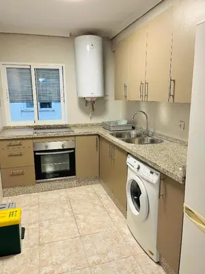Una cocina o zona de cocina en Apartamento El Arenal - Free Parking