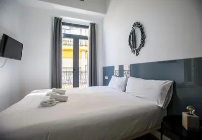 Cama o camas de una habitación en Cardenal Cervantes V