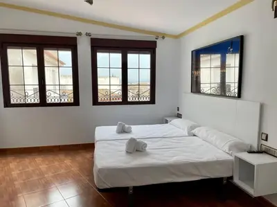 Cama o camas de una habitación en Geysotur Rincón de la Mezquita