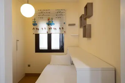 Cama o camas de una habitación en Sol Sevilla Urban Apartment