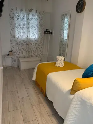 Cama o camas de una habitación en Hostal Casa Blanca