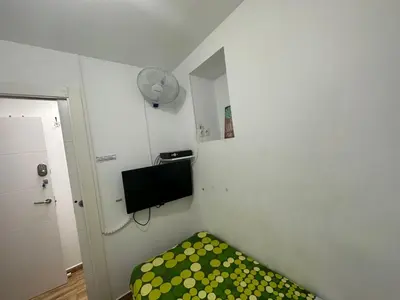 Una televisión o centro de entretenimiento en Casa Sur H1