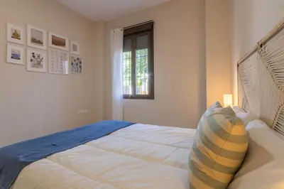 Cama o camas de una habitación en APARTAMENTOS LOS ABUELOS - Cordoba