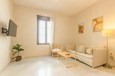 Una televisión o centro de entretenimiento en APARTAMENTOS LOS ABUELOS - Cordoba