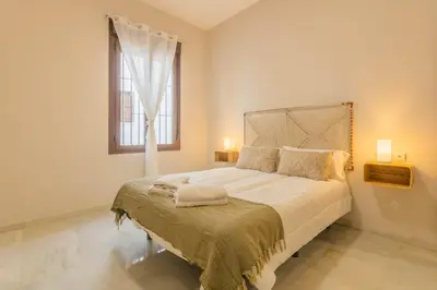 Cama o camas de una habitación en APARTAMENTOS LOS ABUELOS - Cordoba