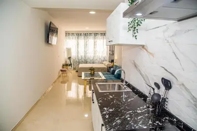 Una televisión o centro de entretenimiento en Apartamentos centro Sandoval
