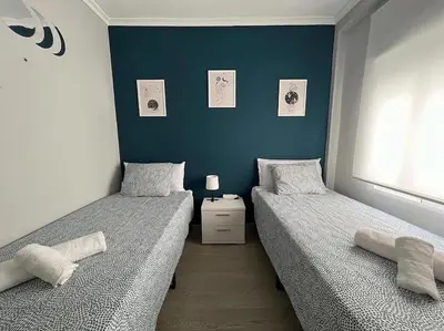 Cama o camas de una habitación en Apto Familiar Balcones a la Muralla