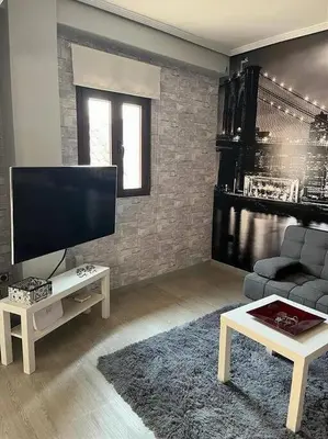 Una televisión o centro de entretenimiento en Apto Familiar Balcones a la Muralla