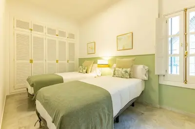 Cama o camas de una habitación en Conde Ibarra Deluxe By Valcambre