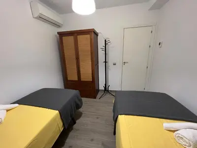 Cama o camas de una habitación en Azahar Macarena