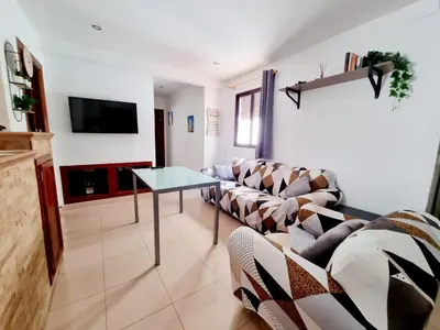 Una televisión o centro de entretenimiento en Apartamento Muralla