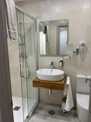 Un baño de Hotel Apartamentos Antequera