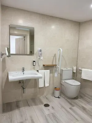 Un baño de Hotel Apartamentos Antequera