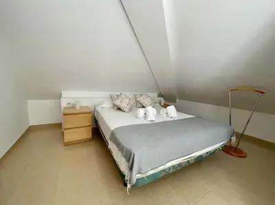 Cama o camas de una habitación en Geysotur El Ático Blanco