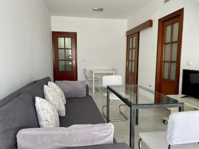 Una televisión o centro de entretenimiento en Geysotur El Ático Blanco