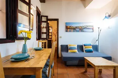 Zona de estar de Tranquilo apartamento en patio sevillano