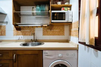 Una cocina o zona de cocina en Tranquilo apartamento en patio sevillano