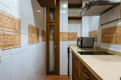 Una cocina o zona de cocina en Tranquilo apartamento en patio sevillano