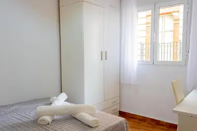 Cama o camas de una habitación en WISH SUITE ALAMEDA DE SEVILLA