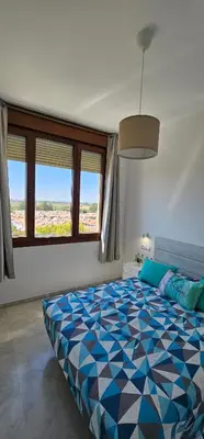 Cama o camas de una habitación en Apto Lux Sevilla