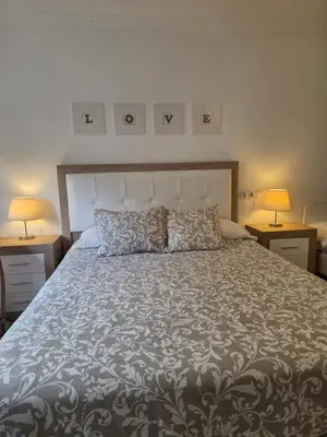 Cama o camas de una habitación en Casa Rural Rocío -Caminito del Rey