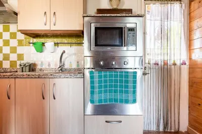 Una cocina o zona de cocina en Casa de Madera del Turullote