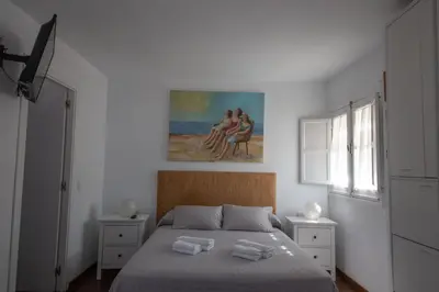 Cama o camas de una habitación en Apartment Seville Mirador Puerta Carmona