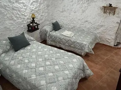 Cama o camas de una habitación en Casa/Cueva el Cigarrillo