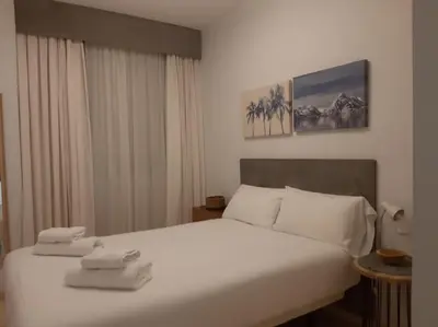 Cama o camas de una habitación en NUEVO-LUMINOSO Y MODERNO. Parking gratis!!
