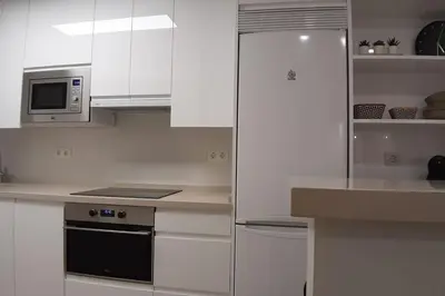 Una cocina o zona de cocina en NUEVO-LUMINOSO Y MODERNO. Parking gratis!!