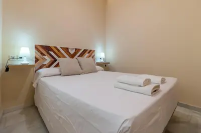 Cama o camas de una habitación en Céntrico apartamento Alfonso XIII