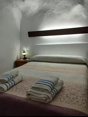 Cama o camas de una habitación en Alojamiento rural casa cueva abuelo Miguel