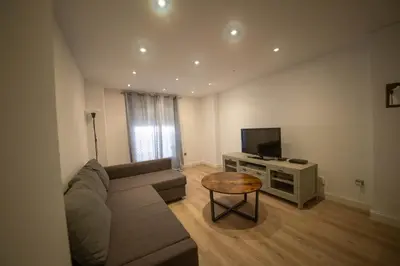 Una televisión o centro de entretenimiento en Apartment Seville Center Caleria
