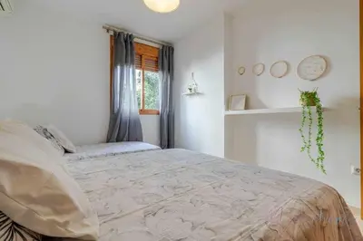 Cama o camas de una habitación en Apartamento 4 en Estadio Sevilla 8 plazas y metro