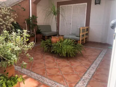 Jardín al aire libre en Familia anfitriona acoge