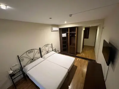 Cama o camas de una habitación en Hostal el Pasaje