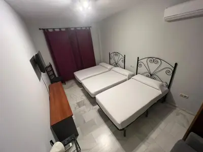 Cama o camas de una habitación en Hostal el Pasaje