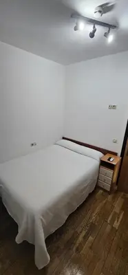 Cama o camas de una habitación en Hostal el Pasaje