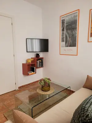 Una televisión o centro de entretenimiento en Light of Seville