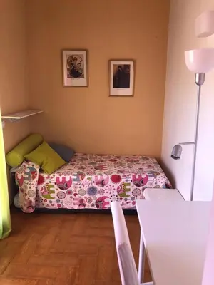 Cama o camas de una habitación en Familia Anfitriona acoge terraza