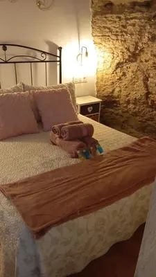 Cama o camas de una habitación en Casa Cueva Sol y Luna Setenil