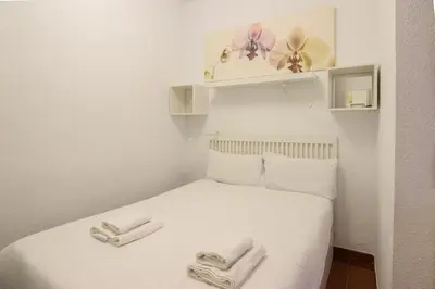 Cama o camas de una habitación en RentalSevilla Joaquín Costa