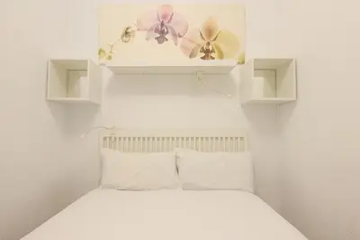 Cama o camas de una habitación en RentalSevilla Joaquín Costa