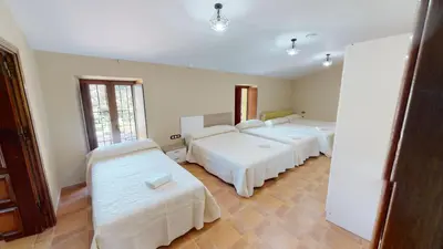 Cama o camas de una habitación en Casa con encanto, gran capacidad alojamiento-24 personas